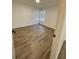 Spacious bedroom with wood-look floors and large windows at 315 Lakepointe Dr # 302, Altamonte Springs, FL 32701