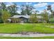 Ranch-style home with a landscaped lawn and walkway at 324 Valley Dr, Longwood, FL 32779