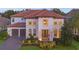 Stunning two-story house with a terracotta roof and landscaped yard at 3867 Grassland Loop, Lake Mary, FL 32746