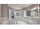 Large Primary bathroom with double vanity, soaking tub and marble floors at 3867 Grassland Loop, Lake Mary, FL 32746