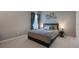 Cozy bedroom with plush carpet and window coverings at 3867 Grassland Loop, Lake Mary, FL 32746