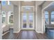 Grand entryway with double doors and hardwood flooring at 3867 Grassland Loop, Lake Mary, FL 32746