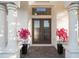 Elegant entryway with double doors and lush landscaping at 3867 Grassland Loop, Lake Mary, FL 32746