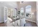 Bright home office features wood floors, large windows, and French doors at 3867 Grassland Loop, Lake Mary, FL 32746