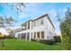House exterior showcasing a large backyard and screened balcony at 3867 Grassland Loop, Lake Mary, FL 32746