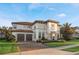 Two-story house with Mediterranean style and attractive landscaping at 3867 Grassland Loop, Lake Mary, FL 32746