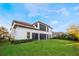 House exterior showcasing a large backyard and screened balcony at 3867 Grassland Loop, Lake Mary, FL 32746