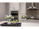 Close up of kitchen island with a bowl of fruit and flowers at 3867 Grassland Loop, Lake Mary, FL 32746