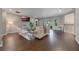 Open living space with hardwood floors, modern furniture, and dining area at 3867 Grassland Loop, Lake Mary, FL 32746