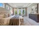 Luxurious main bedroom with large windows, plush bedding, and plenty of space at 3867 Grassland Loop, Lake Mary, FL 32746
