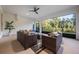Relaxing screened patio with wicker furniture and view of backyard at 3867 Grassland Loop, Lake Mary, FL 32746