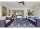 Spacious screened patio furnished with wicker seating at 3867 Grassland Loop, Lake Mary, FL 32746