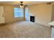 Living room with carpeted floors, fireplace, and ceiling fan at 485 Forestway Cir # 202, Altamonte Springs, FL 32701