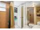Bathroom with shower, toilet and access to the pool at 5027 Jamaica Cir # 7, Orlando, FL 32808