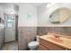 Small bathroom with a toilet, sink, and door at 5027 Jamaica Cir # 7, Orlando, FL 32808