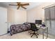 Bedroom featuring a bed, desk, and window at 5027 Jamaica Cir # 7, Orlando, FL 32808