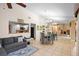 Open dining area with glass table and view into living room and kitchen at 5027 Jamaica Cir # 7, Orlando, FL 32808