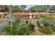 Community view with lush landscaping and pond at 5027 Jamaica Cir # 7, Orlando, FL 32808