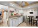 Kitchen features a breakfast bar and view into adjacent dining area at 5027 Jamaica Cir # 7, Orlando, FL 32808