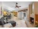 Spacious living area with a gray sectional sofa and view of the dining area at 5027 Jamaica Cir # 7, Orlando, FL 32808