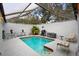 Enclosed pool area with patio furniture at 5027 Jamaica Cir # 7, Orlando, FL 32808