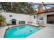 Enclosed pool with grill and seating area at 5027 Jamaica Cir # 7, Orlando, FL 32808