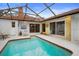 Enclosed pool area with patio furniture at 5027 Jamaica Cir # 7, Orlando, FL 32808