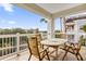 Balcony with wooden table and chairs overlooking the community at 7612 Sandy Ridge Dr # 304, Kissimmee, FL 34747