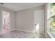 Spacious bedroom with large window and access to bathroom at 8827 Sw 137Th Ct, Ocala, FL 34481