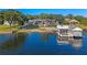 Picturesque aerial view of a waterfront home at sunset at 100 Blue Lake Ct, Longwood, FL 32779