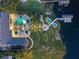 Nighttime aerial view showcasing the pool, spa, dock, and putting green at 100 Blue Lake Ct, Longwood, FL 32779