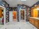 View of the spacious primary bathroom with closet access and unique fish wallpaper at 100 Blue Lake Ct, Longwood, FL 32779