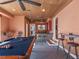 Entertaining game room complete with a pool table, wet bar, and ample seating at 100 Blue Lake Ct, Longwood, FL 32779