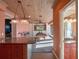 Open-concept game room with a pool table, wet bar, and access to a bathroom at 100 Blue Lake Ct, Longwood, FL 32779