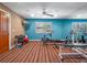 Home gym with workout equipment, striped carpet, and a window at 100 Blue Lake Ct, Longwood, FL 32779