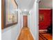 Hallway with hardwood floors and doorways leading to other rooms at 100 Blue Lake Ct, Longwood, FL 32779