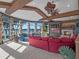 Grand living area with fireplace, water views, and unique decor at 100 Blue Lake Ct, Longwood, FL 32779