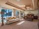 Main bedroom featuring large windows overlooking tranquil water views at 100 Blue Lake Ct, Longwood, FL 32779