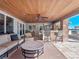 Outdoor patio with seating area, bar, and a wooden ceiling at 100 Blue Lake Ct, Longwood, FL 32779