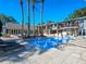 Private pool area with ample space for lounging and entertaining, overlooking the lake at 100 Blue Lake Ct, Longwood, FL 32779