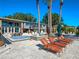 Relaxing pool area with lounge chairs, perfect for enjoying the Florida sunshine and lake views at 100 Blue Lake Ct, Longwood, FL 32779