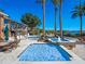 Inviting spa with cascading water features, surrounded by a lush tropical landscape at 100 Blue Lake Ct, Longwood, FL 32779