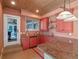 Well-equipped wet bar with ample storage, custom cabinetry, and a pass-through window at 100 Blue Lake Ct, Longwood, FL 32779