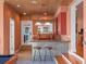 Stylish wet bar with granite countertop, custom cabinets, and convenient access to the game room at 100 Blue Lake Ct, Longwood, FL 32779