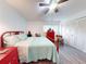 Bright bedroom with a comfortable bed and access to a sliding glass door at 11 Fore Dr, New Smyrna Beach, FL 32168