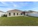 Large backyard with grassy area at 1224 Golden Eagle Ln, Winter Haven, FL 33880