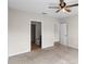 Bedroom with ceiling fan and access to bathroom and hallway at 1224 Golden Eagle Ln, Winter Haven, FL 33880