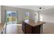 Kitchen with island, stainless steel appliances, and view to backyard at 1224 Golden Eagle Ln, Winter Haven, FL 33880