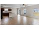 Open living room with kitchen island, tile floors, and backyard access at 1224 Golden Eagle Ln, Winter Haven, FL 33880