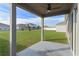 Covered patio overlooking the backyard at 1224 Golden Eagle Ln, Winter Haven, FL 33880